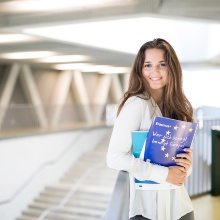 Student with Erasmus+ promotional material in her arms